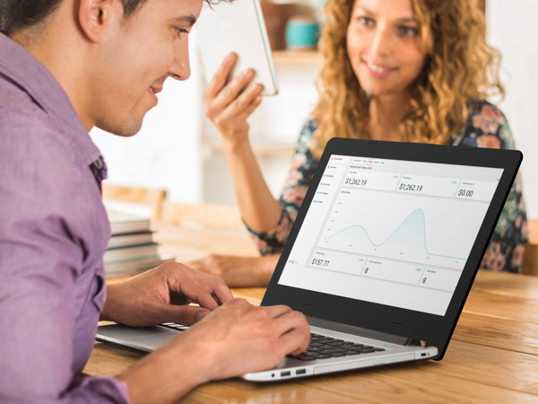 two people reviewing PsyquelPay on a laptop